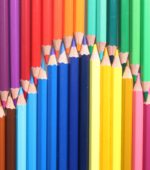 colored pencils lined up in a bright display