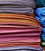 stacks of fabric in several colors
