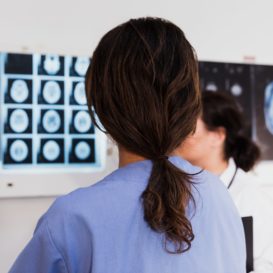 doctor and nurse examine x-rays
