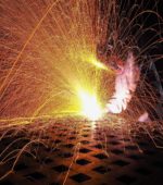 sparks fly from welder