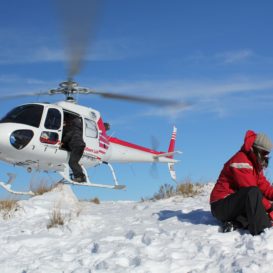 helicopter rescue on top of snowy mountain