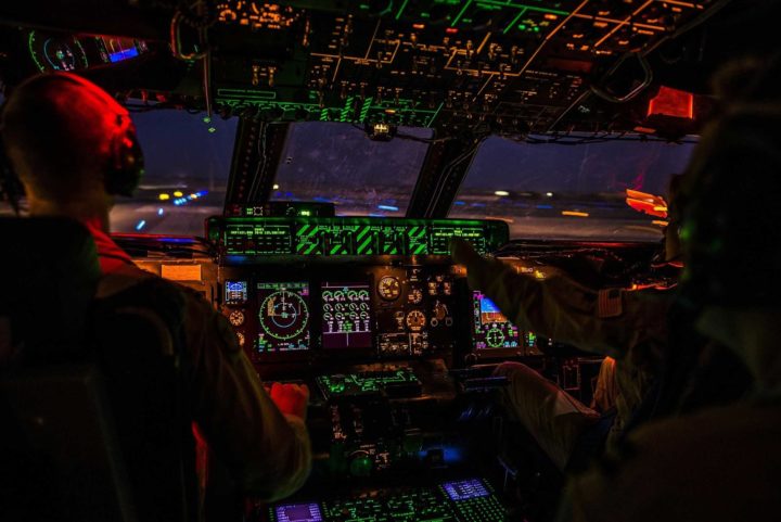 inside of a cockpit with lights at night, part of Aeronautical and Aviation Technology